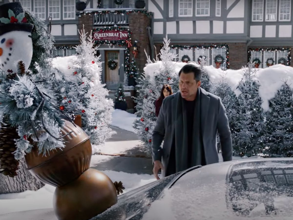 Our 2022 Winnipeg Hallmark Christmas (and Hanukkah) movie guide - Kristoffer Polaha and Marisol Nichols in front of the Granite Curling Club in We Wish You a Married Christmas (Hallmark Channel/YouTube)