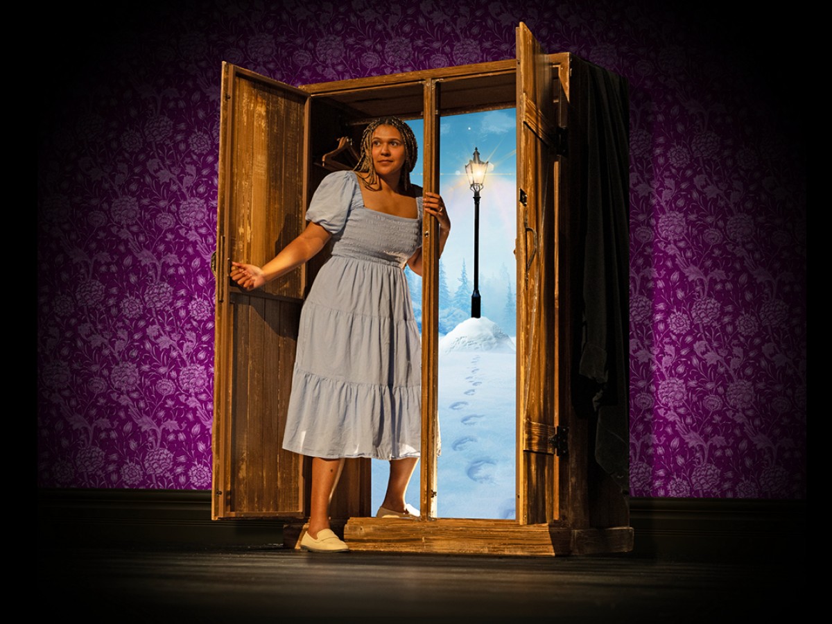 MTYP invites your family to Narnia this holiday season in Winnipeg - Kara Joseph as Susan about to enter the wardrobe in MTYP's Narnia (photo courtesy of MYTP)