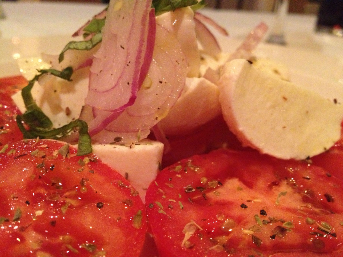 Tre Visi Café: Exquisite Italian - Caprese Salad, freshly sprinkled with spices