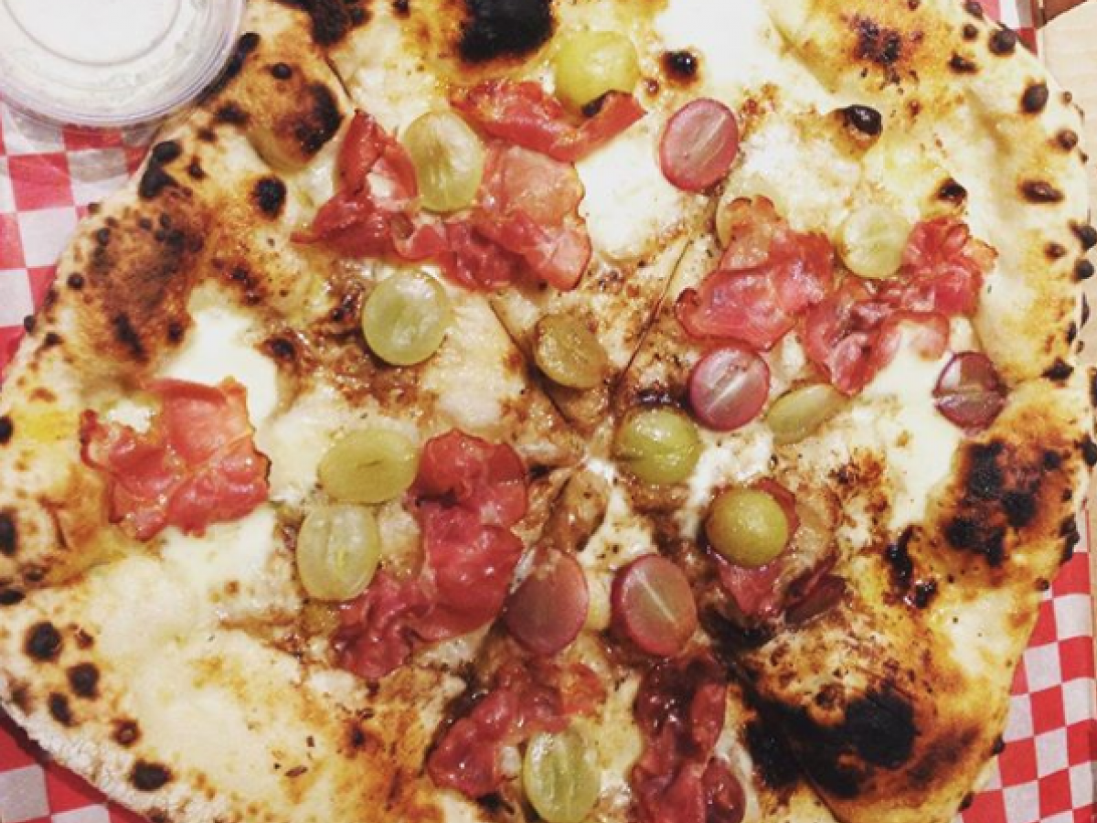 Winnipeg's best pizzas  - Is this ugly delicious grape and blue cheese with pancetta the best pizza in Winnipeg? Our food writer says yes! (PCG)