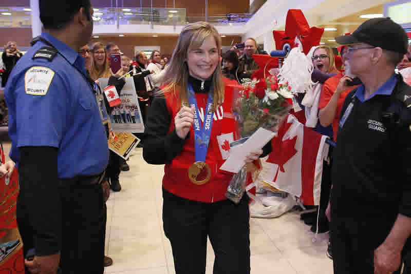 Hundreds greeted Jennifer Jones and her team as they returned to Winnipeg on Monday night. Photo courtesy of John Woods / Winnipeg Free Press