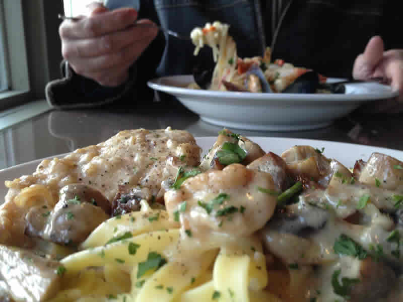 Seafood Sambuca and Lemon Chicken with fettuccine at Monticchio's.