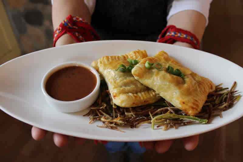 Bison turnovers with fried leeks and gravy at Promenade Café and Wine.