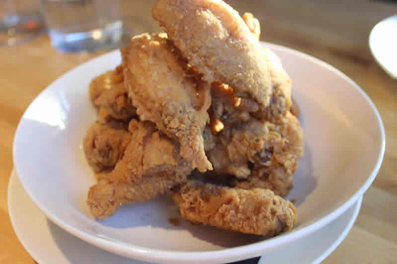 Behold the pile of mighty five-spice chicken wings, The Cornerstone. (Photo by Robin Summerfield.) 
