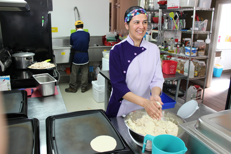 Betty Calderon-Villasenor makes pressing out perfect tortillas look easy (PCG)